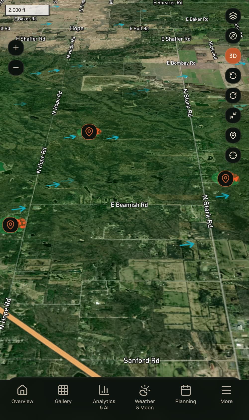 Trail Pro Intel map — satellite terrain with stand pins, live wind-direction arrows, and scent cones over a hunting property